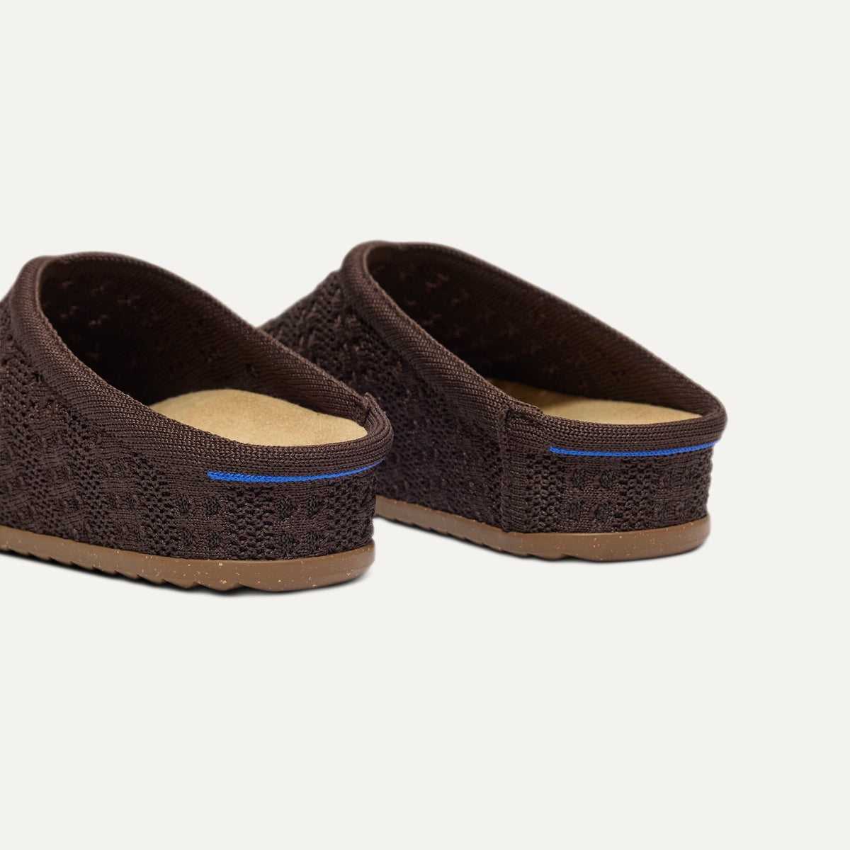 Close up of the heel of The Casual Clog in Chocolate Crochet, with Rothy's signature blue halo.