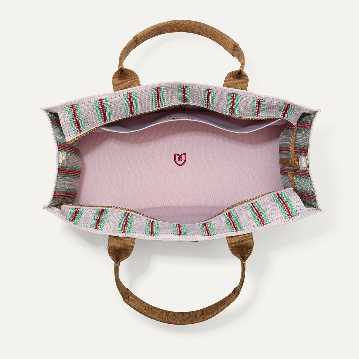 The Classic Tote in Watermelon Market Stripe, shown from above, with the interior exposed.
