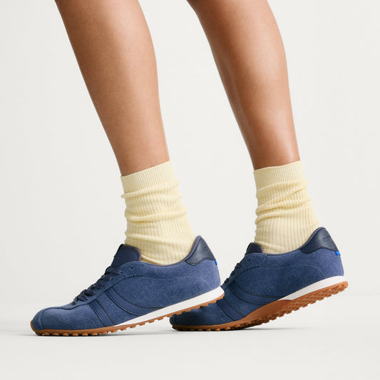 hover | Model wearing The Ivy Sneaker in ReVelvet Overcast.