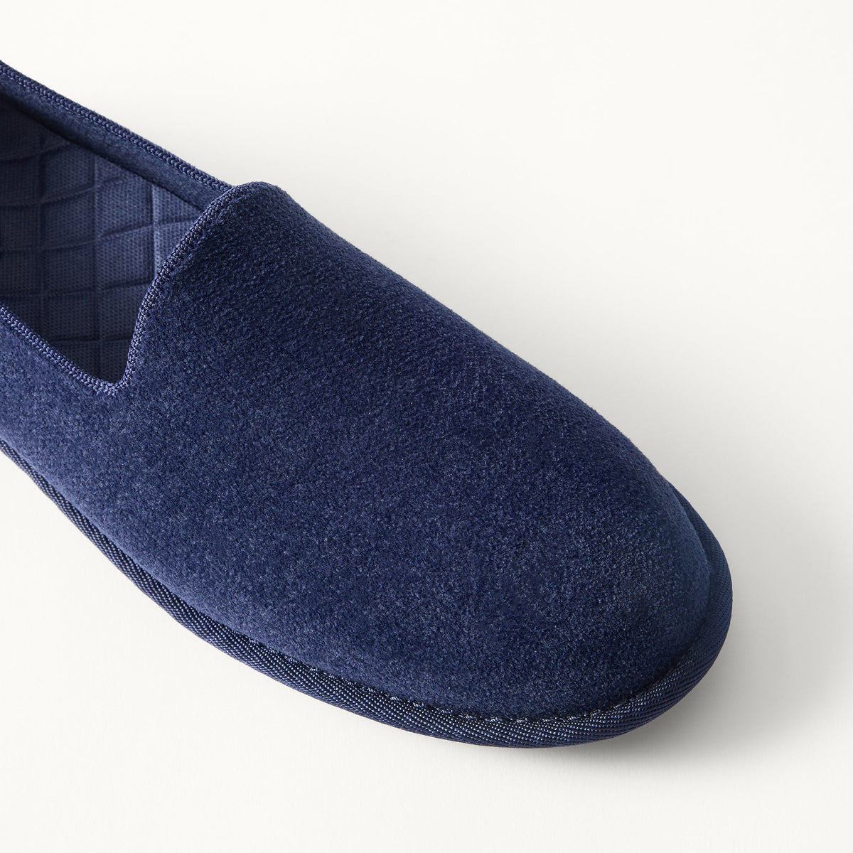 Close up of the toe and vamp of The Men's Cruiser Loafer in ReVelvet™ Deep Navy.