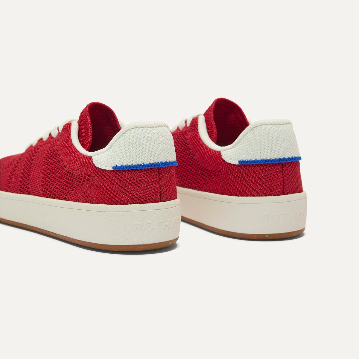 Close up of the heel of The Kids Stretch Sneaker in Firecracker, with Rothy's signature blue halo.