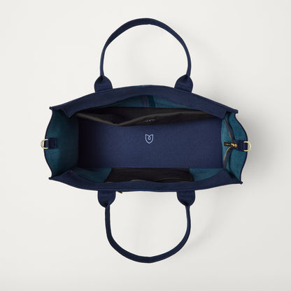The Classic Tote in ReVelvet Peacock, shown from above, with the interior exposed.