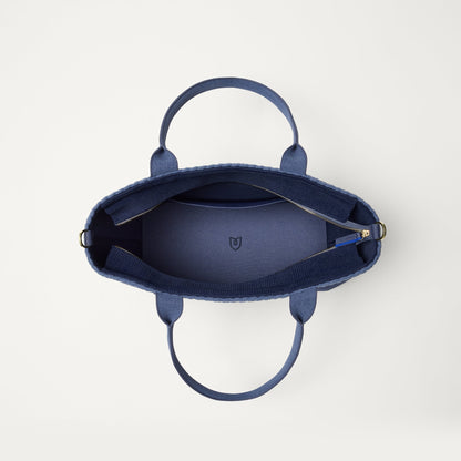 The Lightweight Zip Tote in ReVelvet Deep Navy, shown from above with the interior exposed.