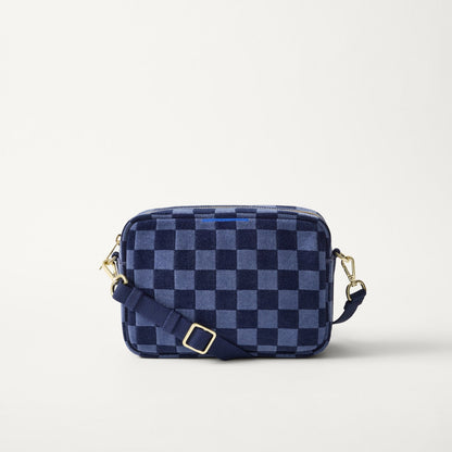 EXT | The Crossbody Camera Bag in ReVelvet™ Blue Ink, shown from the front.