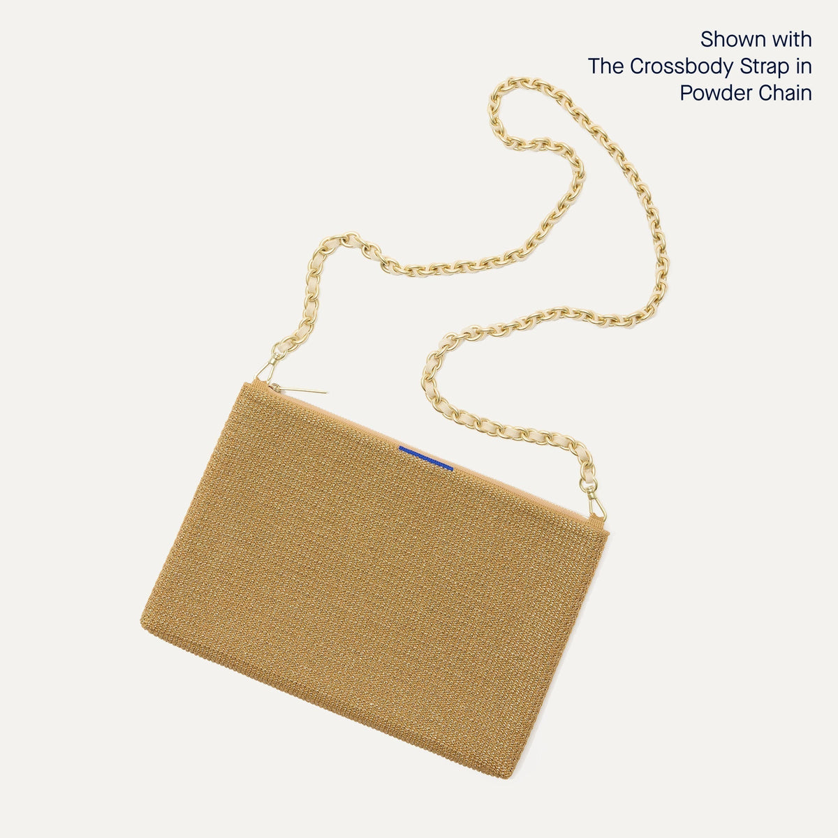 The Convertible Clutch in Glitzy Gold, focusing on the chain strap.
